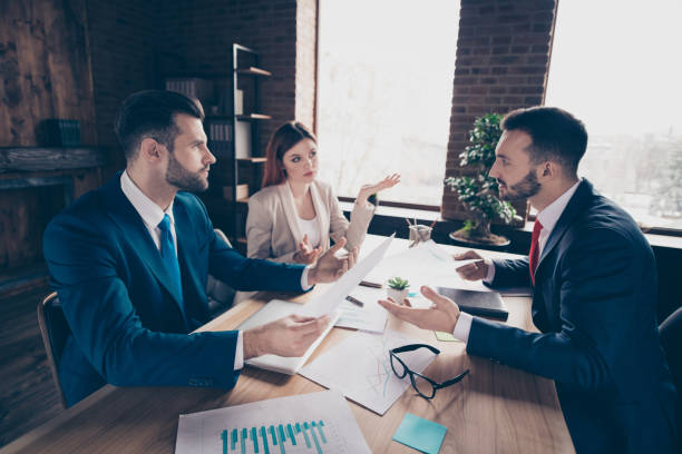 istock Profile side view of three nice classy elegant stylish trendy beautiful handsome executive managers discussing department development in loft industrial interior work place station 1135102483