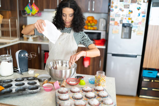 istock Woman baking muffins 1135102958