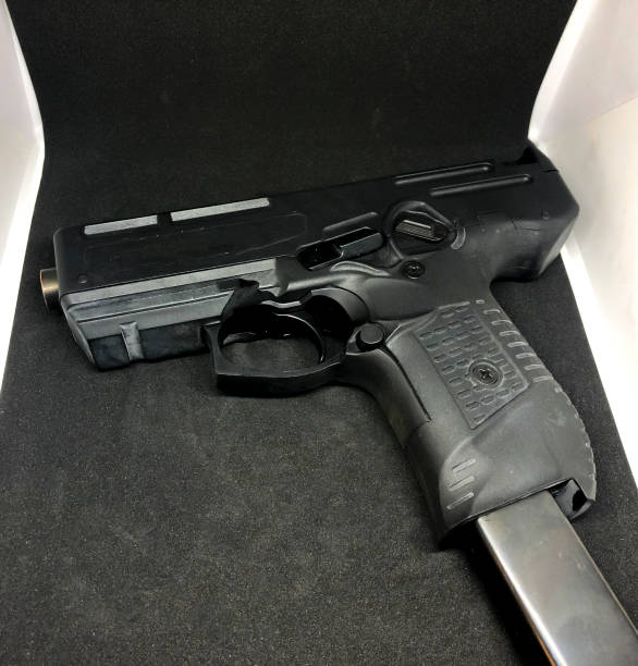 istock Big pistol isolated on dark background. 1135103902