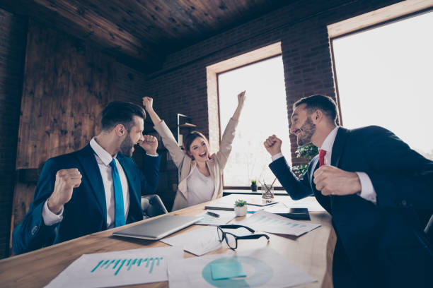 istock Profile side view of three chic elegant stylish trendy beautiful handsome cheerful managers celebrating rejoicing sales department development in loft industrial interior work place station 1135103954