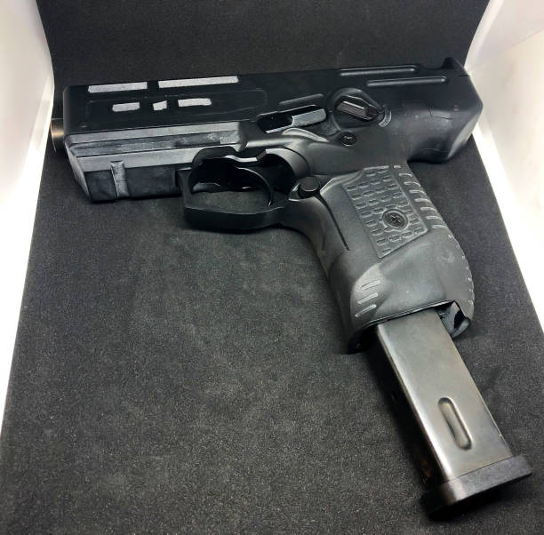 istock Big pistol isolated on dark background. 1135104879