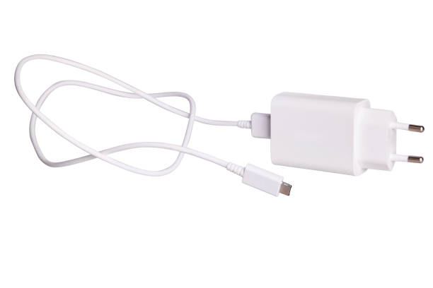 cavo caricabatterie e spina per gadget i - mobile phone charging power plug adapter foto e immagini stock