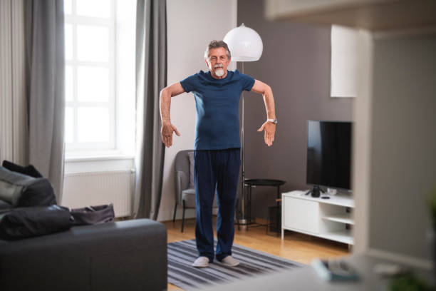 istock Senior man exercising indoors 1135106093