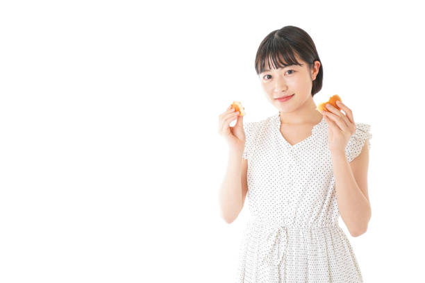 istock Young woman eating bread 1135106142