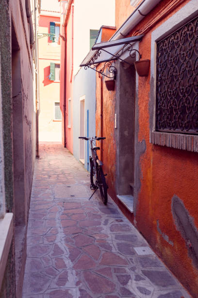 istock narrow street on a burano island 1135106828