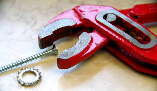 istock Half open water pump pliers and a screw 1135107692
