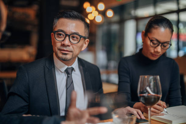 istock Business people in restaurant 1135107806