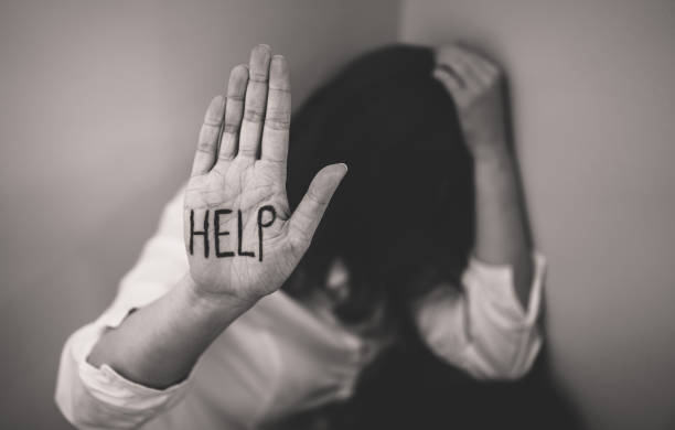 istock Depressed woman holding hand in front her face. Social problems concept. 1135108230