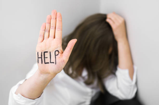 istock Depressed woman in corner. Social problems concept. Place for your text. 1135108239