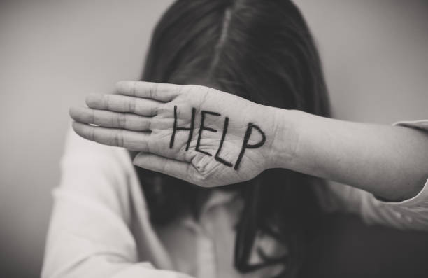 istock Depressed woman holding hand in front her face. Social problems concept. 1135108240