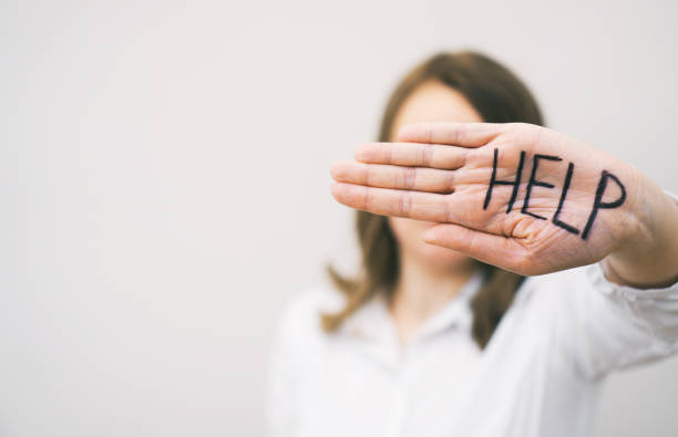 istock Depressed woman holding hand in front her face. Social problems concept. 1135108245
