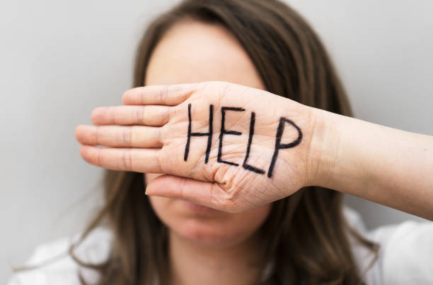 istock Depressed woman holding hand in front her face. Social problems concept. 1135108246