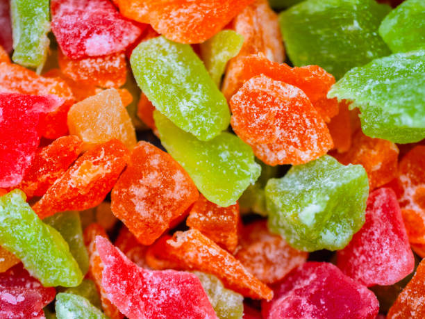 istock candied fruit green orange orange red closeup 1135108252
