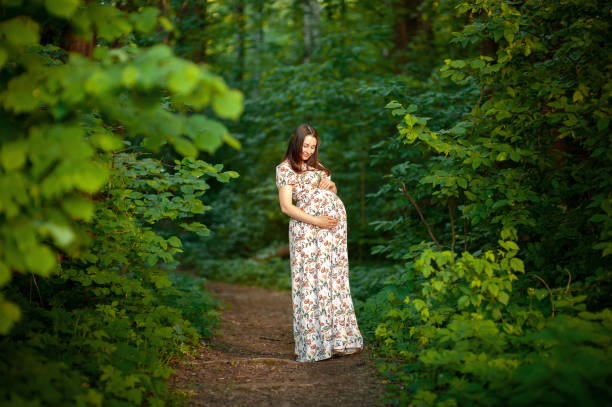 at summer in the forest in long dress