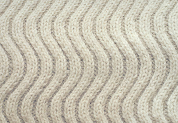 beige white  ttexture of knitted acrylic fabric