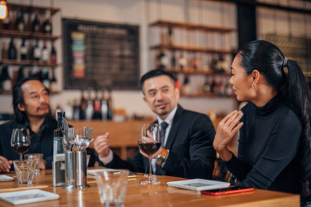 istock Chinese business people sitting in restaurant 1135109879