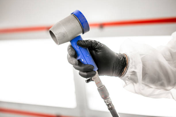 istock Gloved hand holding a pneumatic paint dryer 1135111241