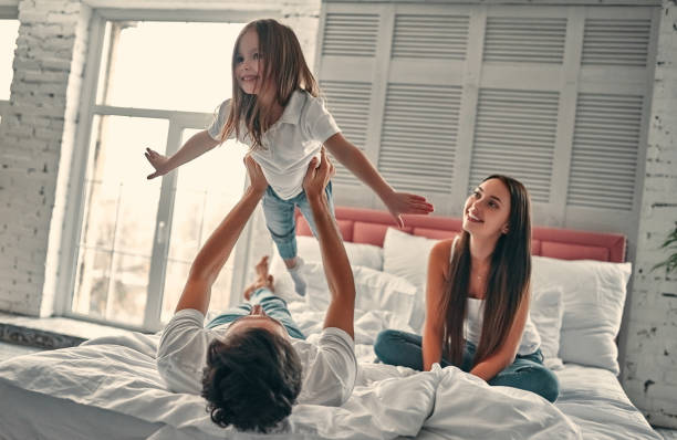 istock Happy family in bed 1135112540