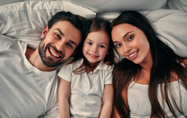 istock Happy family in bed 1135112924