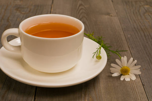 istock organic camomile herbal tea on rustic table 1135114198