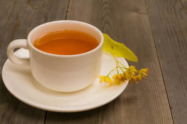 organic linden herbal tea on rustic table