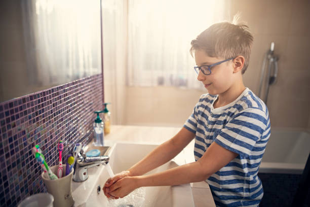 Little boy washing hands