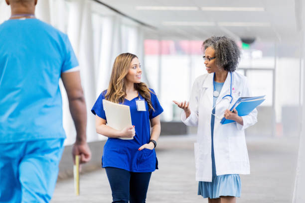 istock Medical professionals walk along elevated walkway 1135117945