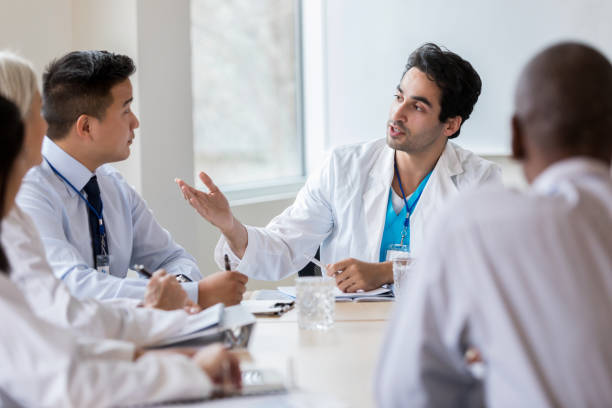 istock Confident doctor talks with hospital administrator 1135118090