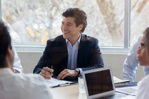 istock Cheerful hospital administrator smiles during meeting 1135118097