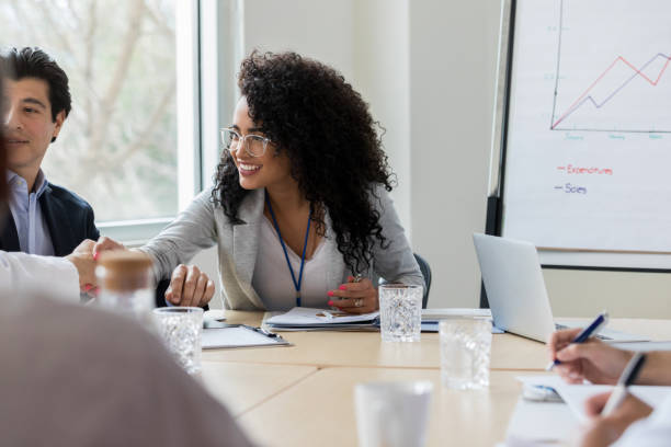 istock Confident businesswoman greets colleague 1135118110
