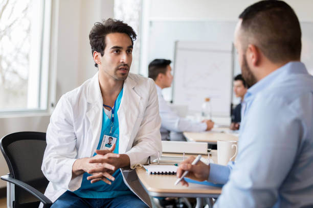 istock Doctor talks with hospital administrator 1135118120