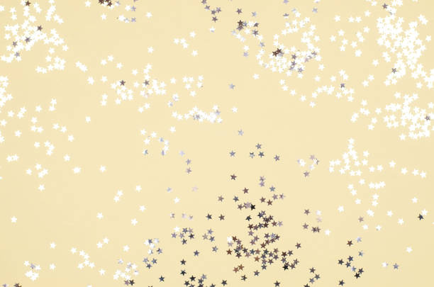 istock Yellow background with many small silver stars. 1135121479