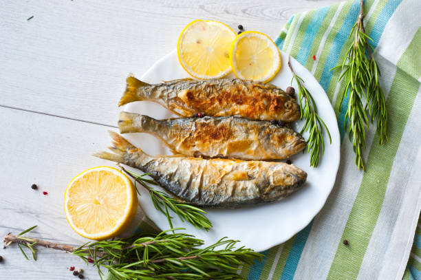 Fried fish with lemon rosemary and pepper.
