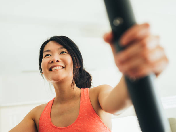 istock Young Asian woman working out 1135121679