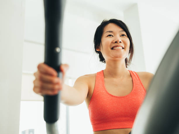 istock Young Asian woman working out 1135121685