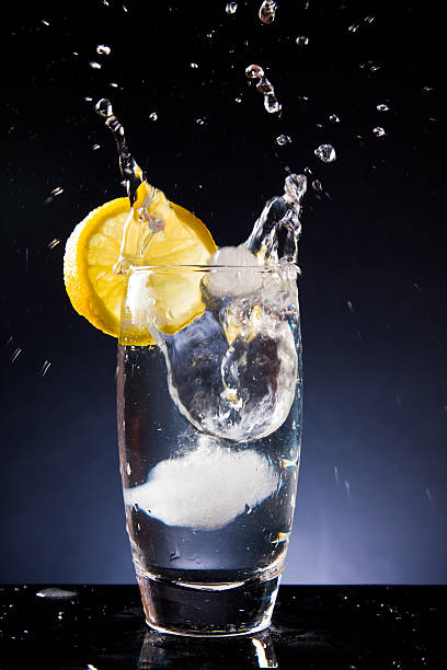istock splashing glass of cold water on a black background 113512196