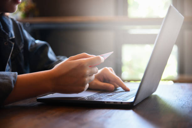istock Online payment,woman's hands holding credit card and using laptop computer for online shopping. Cyber Monday Concept 1135122502