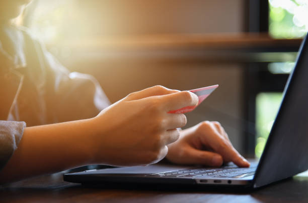 istock Online payment,woman's hands holding credit card and using laptop computer for online shopping. Cyber Monday Concept 1135122533