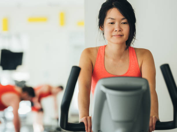 istock Young Asian woman working out 1135122695
