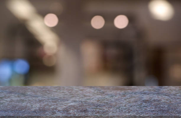 istock Empty marble stone table in front of abstract blurred background of restaurant, cafe and coffee shop interior. can be used for display or montage your products - Image. 1135123277