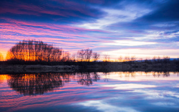 istock Stunning sunset with reflections on a lake 1135123601