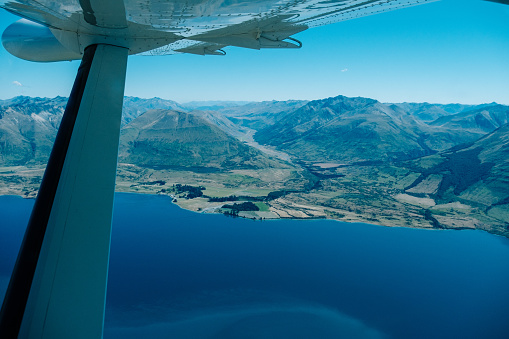 Private Jet above Beautiful Landscape