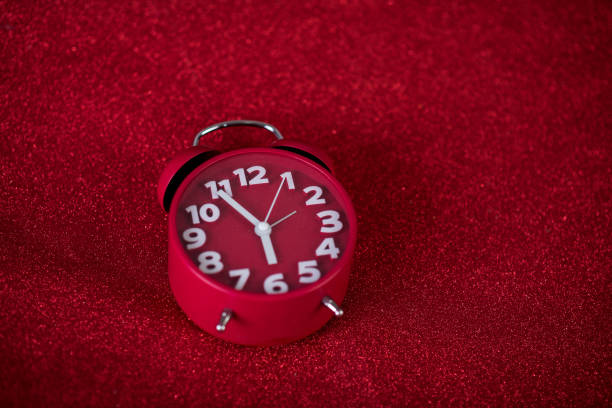 istock Red background image and beautiful red alarm clock Concept, time, date 1135126940