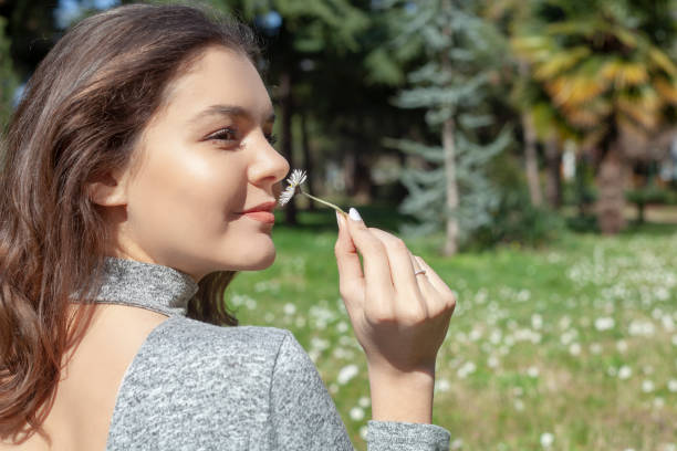 istock women smelling the flower 1135126996