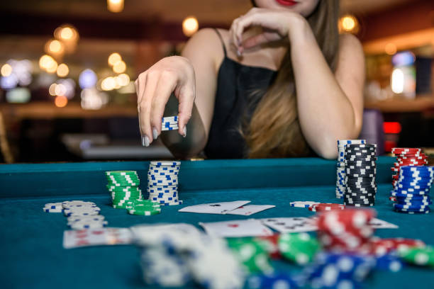 istock Female hand taking poker chips from pile 1135128093