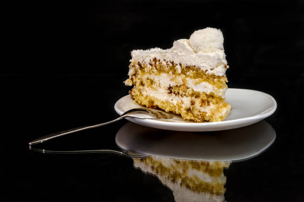 istock Piece of tasty cake on plate with reflection 1135128347