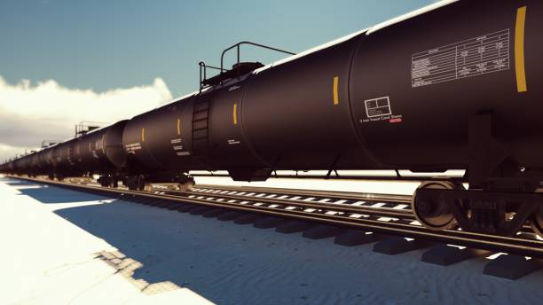 The camera flies past the railroad with cisterns passing through it with oil. 3D Rendering The camera flies past the railroad with cisterns passing through it with oil. rail car stock pictures, royalty-free photos & images