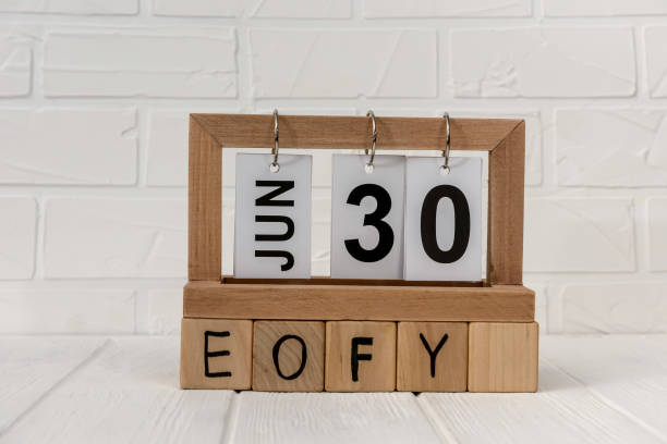 Wooden calendar with cubes and word EOFY stock photo