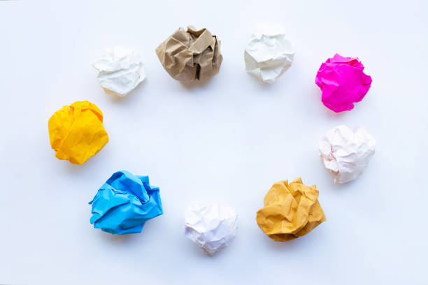 istock Colorful crumpled paper ball isolated on white. 1135129800