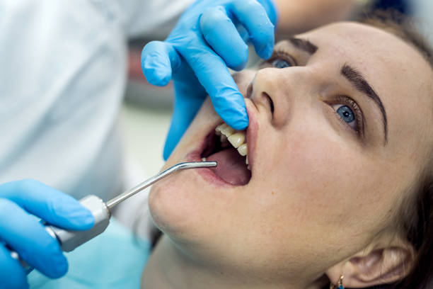 istock Patient in dentistry with stomatological tools, closeup 1135130277